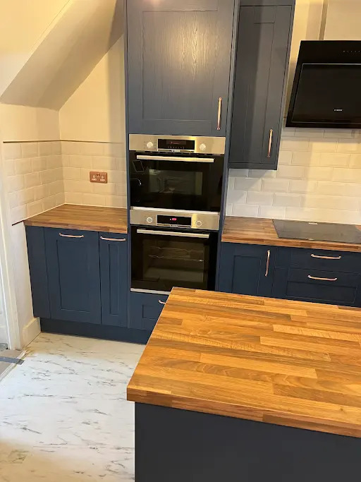 Navy shaker kitchen with oak worktops